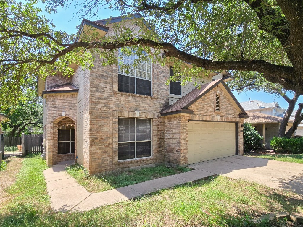 8021 Rimini Trail Austin, TX 78729 - Photo 2 of 26 a view of a yard in front view of a house