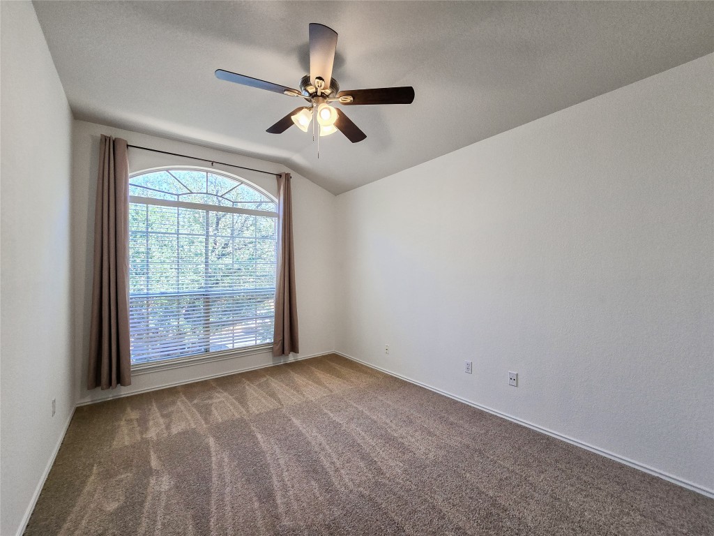 8021 Rimini Trail Austin, TX 78729 - Photo 22 of 26 a view of an empty room with a window