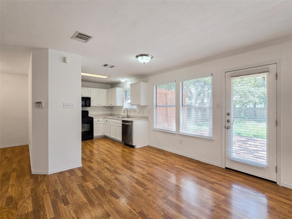 8021 Rimini Trail Austin, TX 78729 - Photo 10 of 26 a view of kitchen with wooden floor