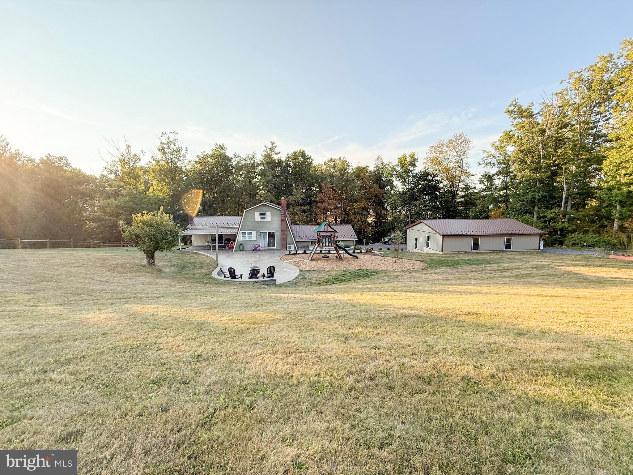 78 Fairview Road Belleville, PA 17004 - Photo 14 of 57 a view of a swimming pool with a playground and mountain view