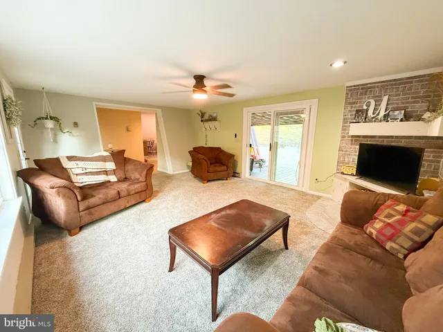 a view of a bedroom with wooden floor
