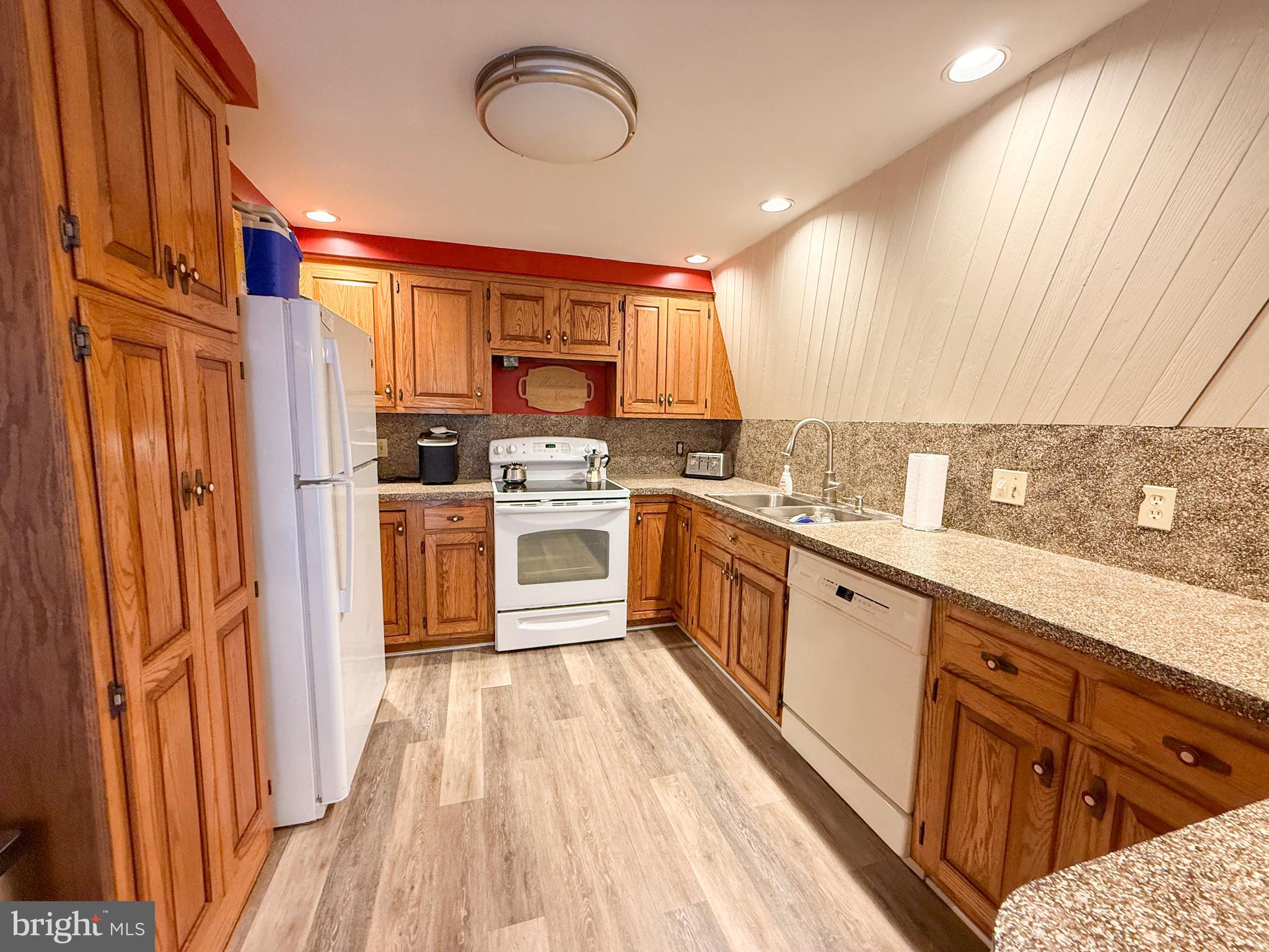 78 Fairview Road Belleville, PA 17004 - Photo 27 of 57 a kitchen with stainless steel appliances a sink cabinets and wooden floor