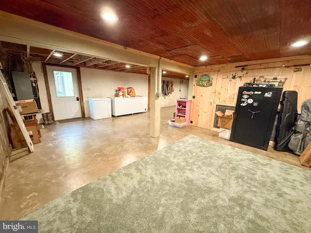 a living room with lots of furniture and gym equipment