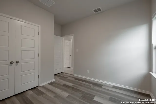 a view of room with hardwood floor