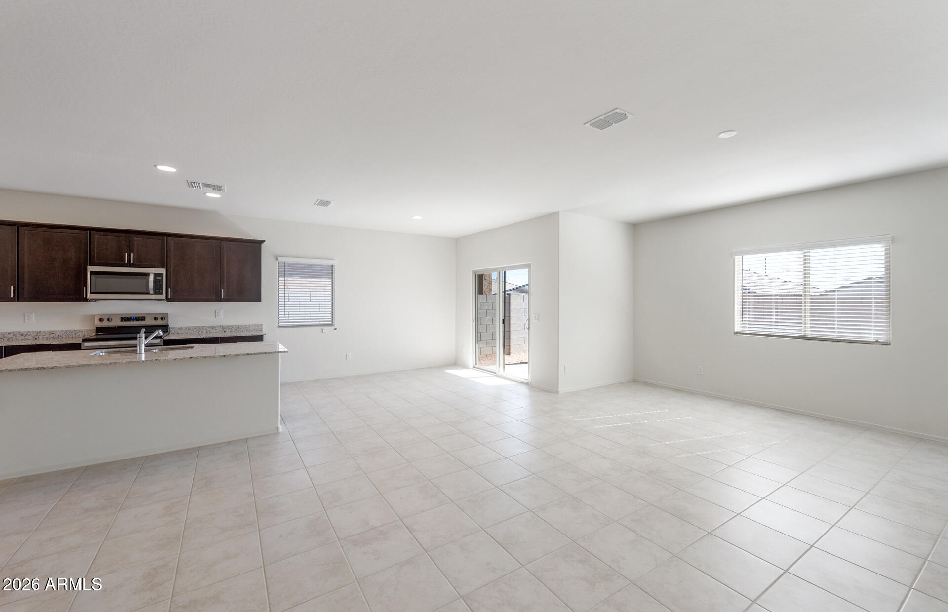 43020 West Palo Amarillo Road Maricopa, AZ 85138 - Photo 9 of 20 8 - Gathering Room and Kitchen