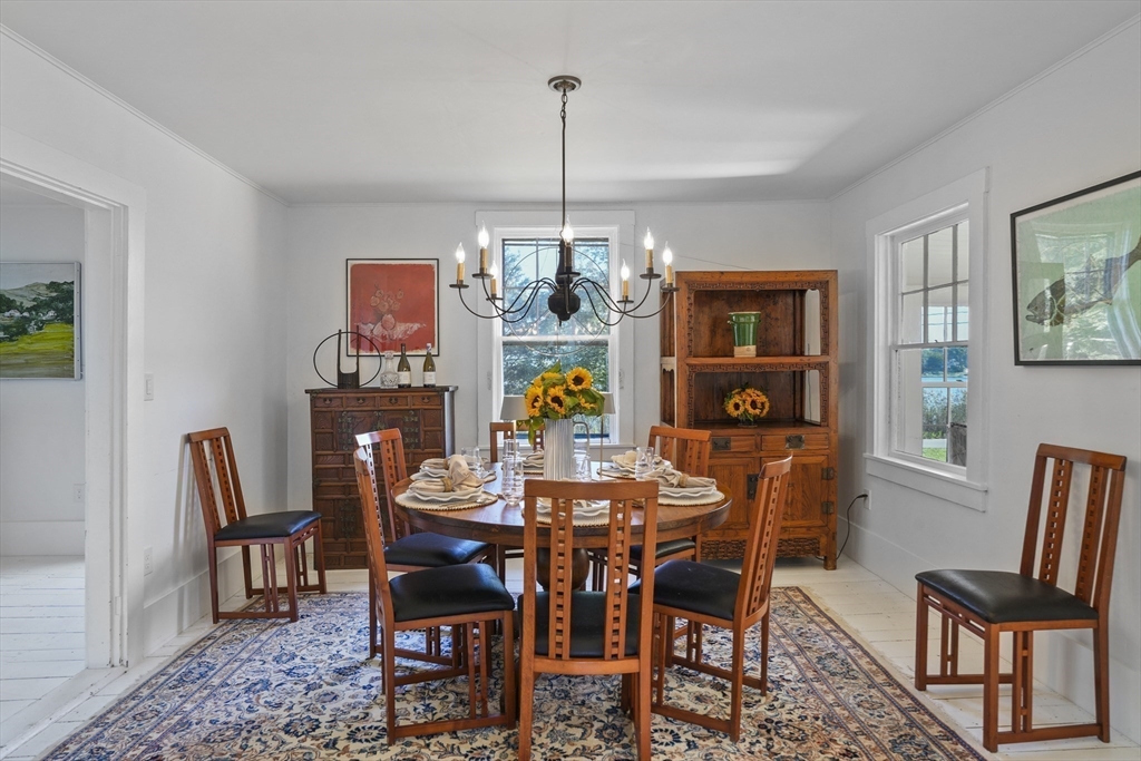 187 Lagoon Pond Road Tisbury, MA 02568 - Photo 13 of 27 a view of a dining room with furniture window and wooden floor