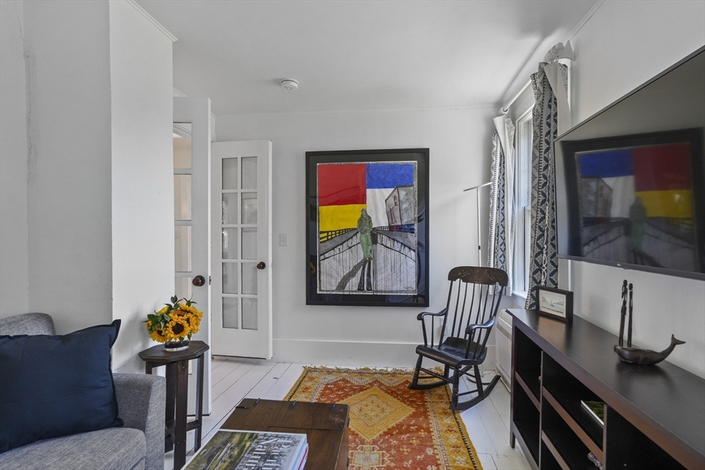187 Lagoon Pond Road Tisbury, MA 02568 - Photo 15 of 27 a living room with furniture and a flat screen tv
