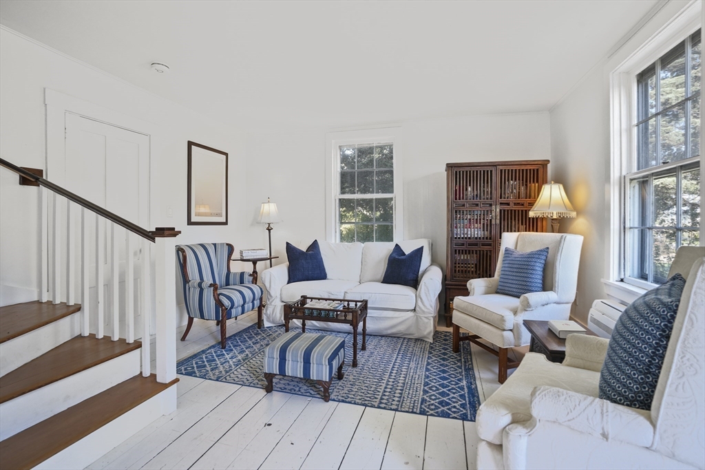 187 Lagoon Pond Road Tisbury, MA 02568 - Photo 16 of 27 a living room with furniture and a table