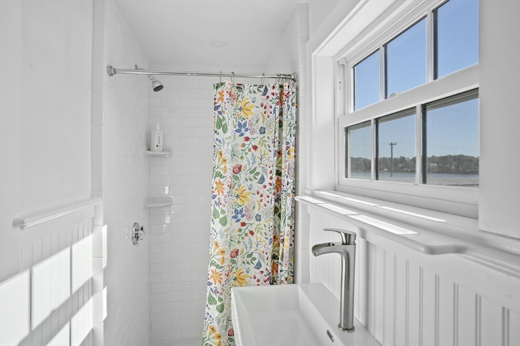 187 Lagoon Pond Road Tisbury, MA 02568 - Photo 23 of 27 a view of a door with glass door