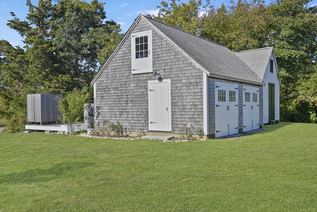 187 Lagoon Pond Road Tisbury, MA 02568 - Photo 24 of 27 a view of a house with a yard