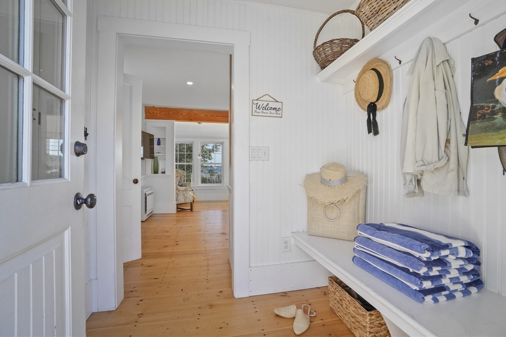187 Lagoon Pond Road Tisbury, MA 02568 - Photo 4 of 27 a bathroom with a toilet a sink and mirror