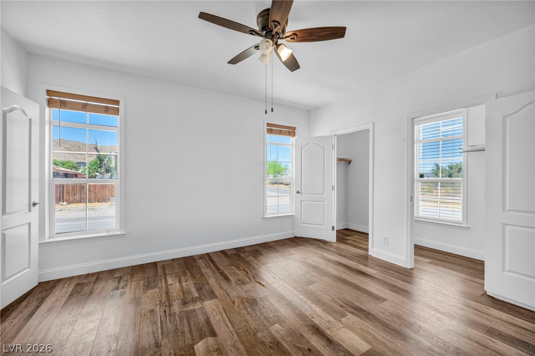 225 California Street Searchlight, NV 89046 - Photo 49 of 64 Wood-look flooring and a functional ceiling fan complete this comfortable living space.