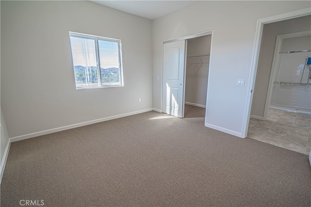 10540 Darling Road Agua Dulce, CA 91390 - Photo 31 of 56 an empty room with windows