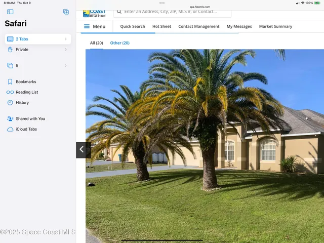 a view of outdoor space with garden and trees