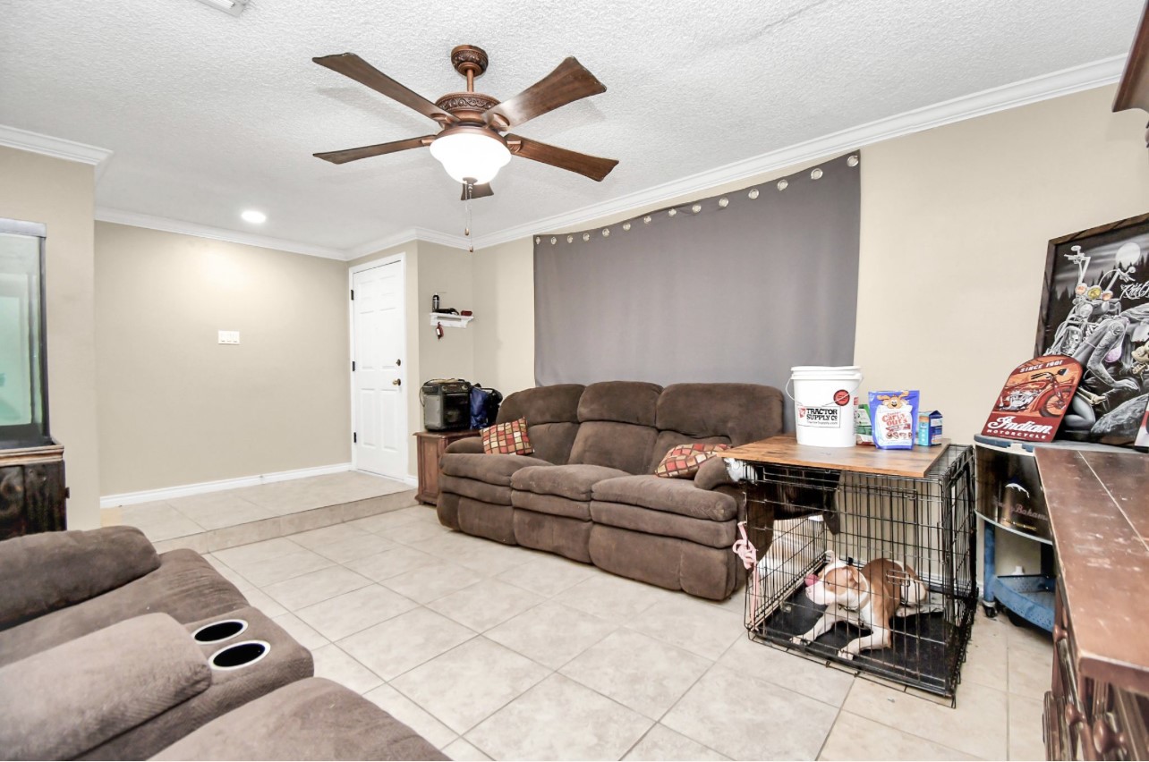 712 Meadowick Drive Baytown, TX 77521 - Photo 6 of 21 a living room with furniture and a wooden floor