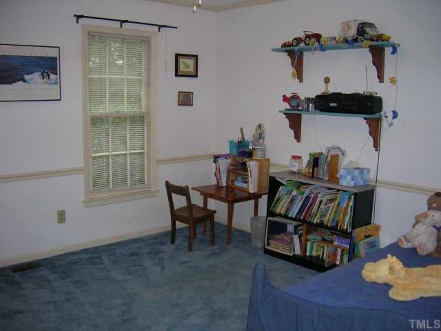 308 Merwin Road Raleigh, NC 27606 - Photo 7 of 7 a living room with furniture and a window