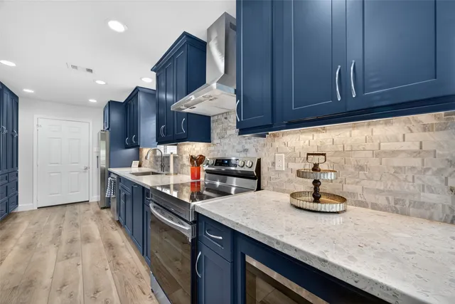 a kitchen with sink cabinets and stove