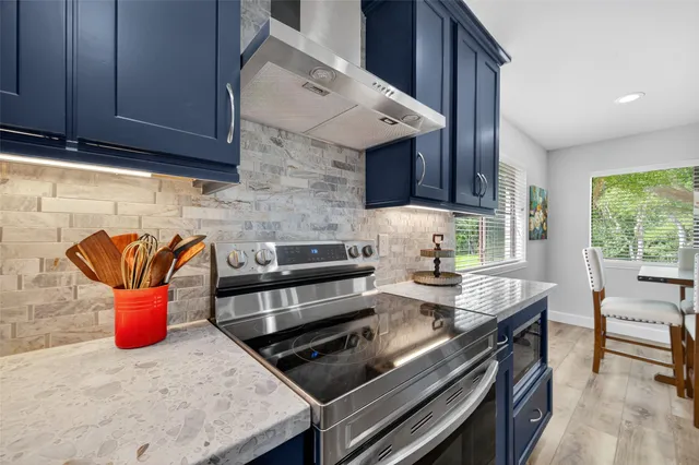 a kitchen with a stove and a microwave