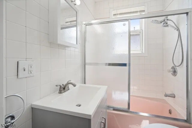 a bathroom with a sink and shower
