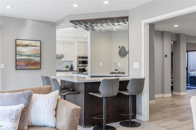 a view of balcony with two chairs and a potted plant