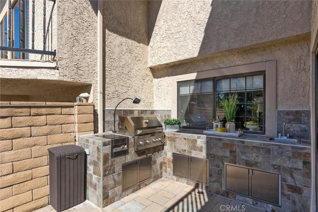 a view of a patio with couple of chairs