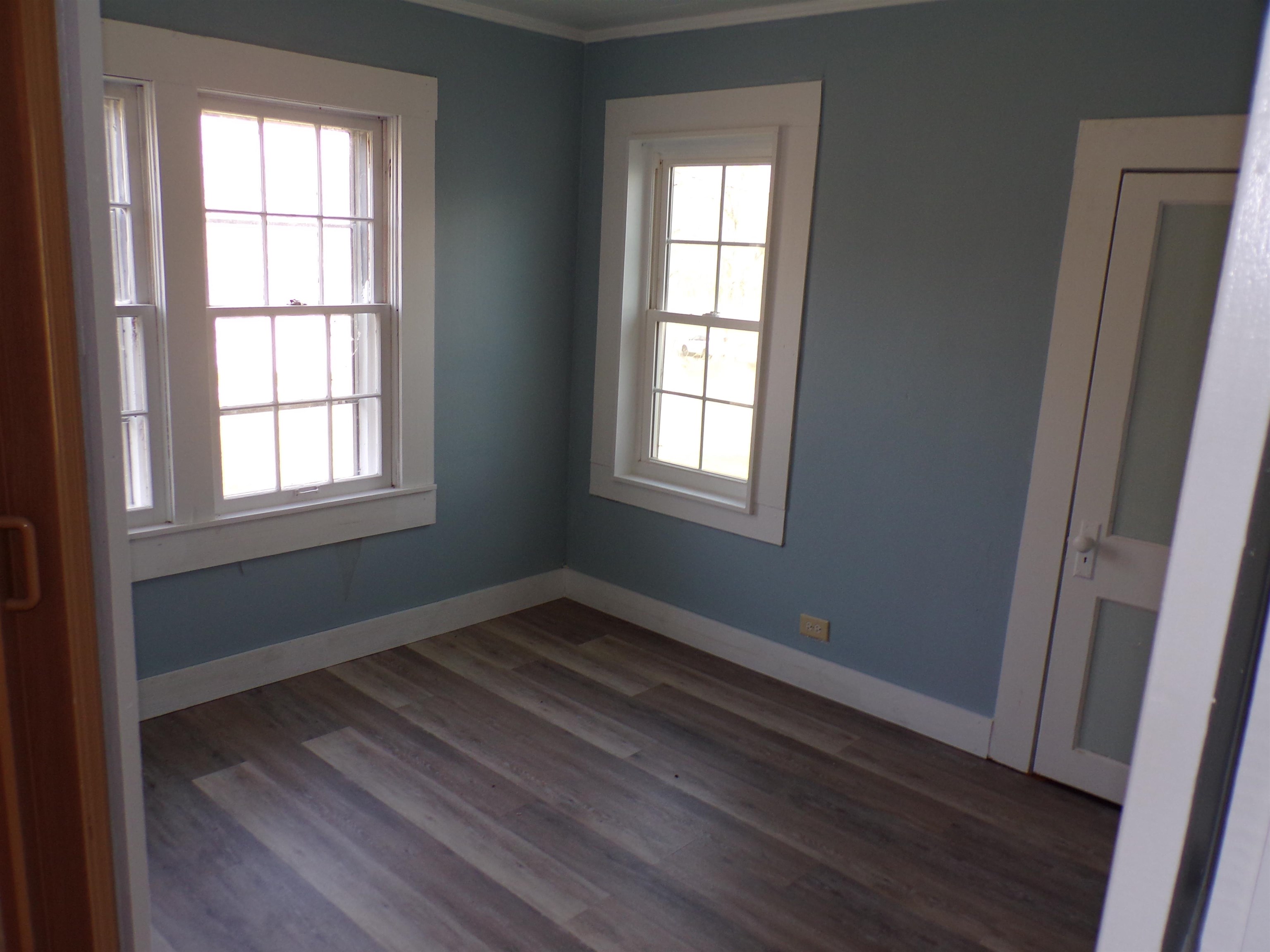 5950 Highway 57 Counce, TN 38326 - Photo 11 of 23 Empty room featuring baseboards and dark wood finished floors
