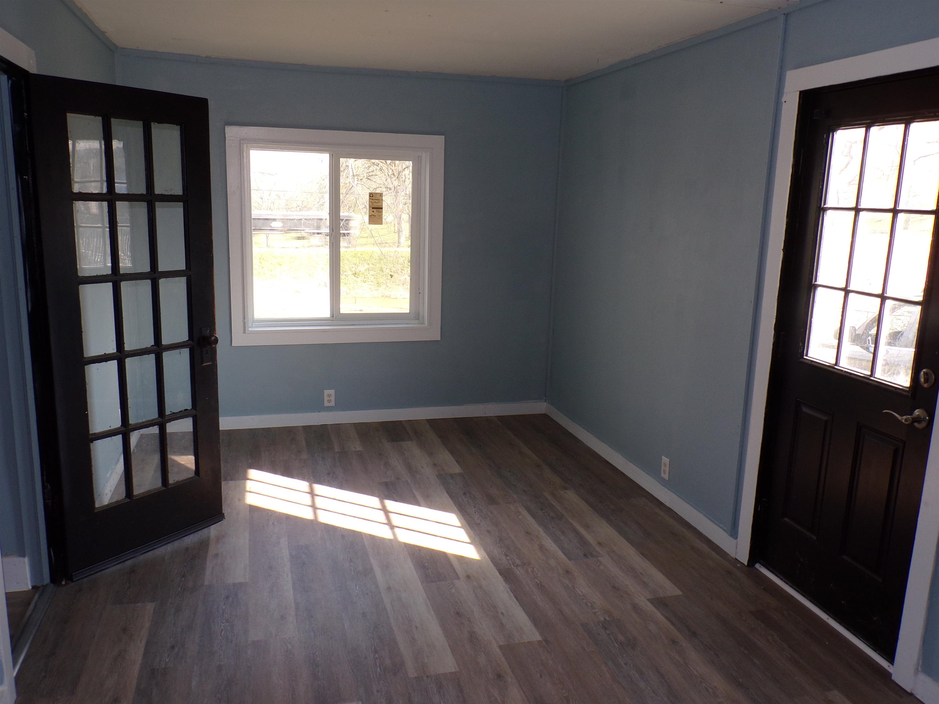 5950 Highway 57 Counce, TN 38326 - Photo 16 of 23 Entryway with dark wood finished floors and baseboards