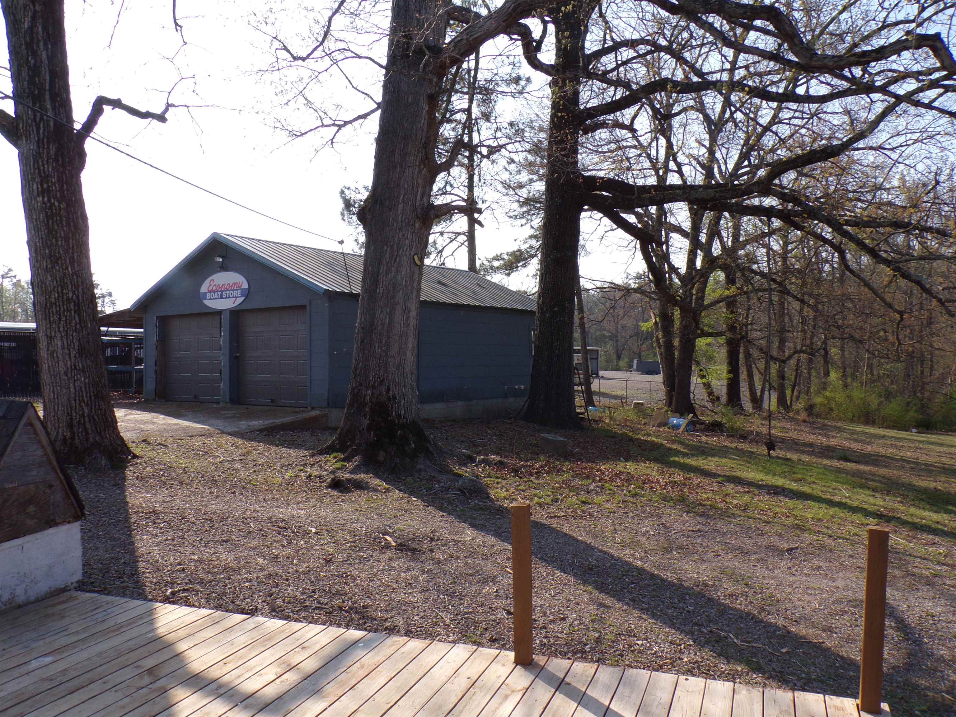 5950 Highway 57 Counce, TN 38326 - Photo 22 of 23 Deck featuring a garage and an outbuilding
