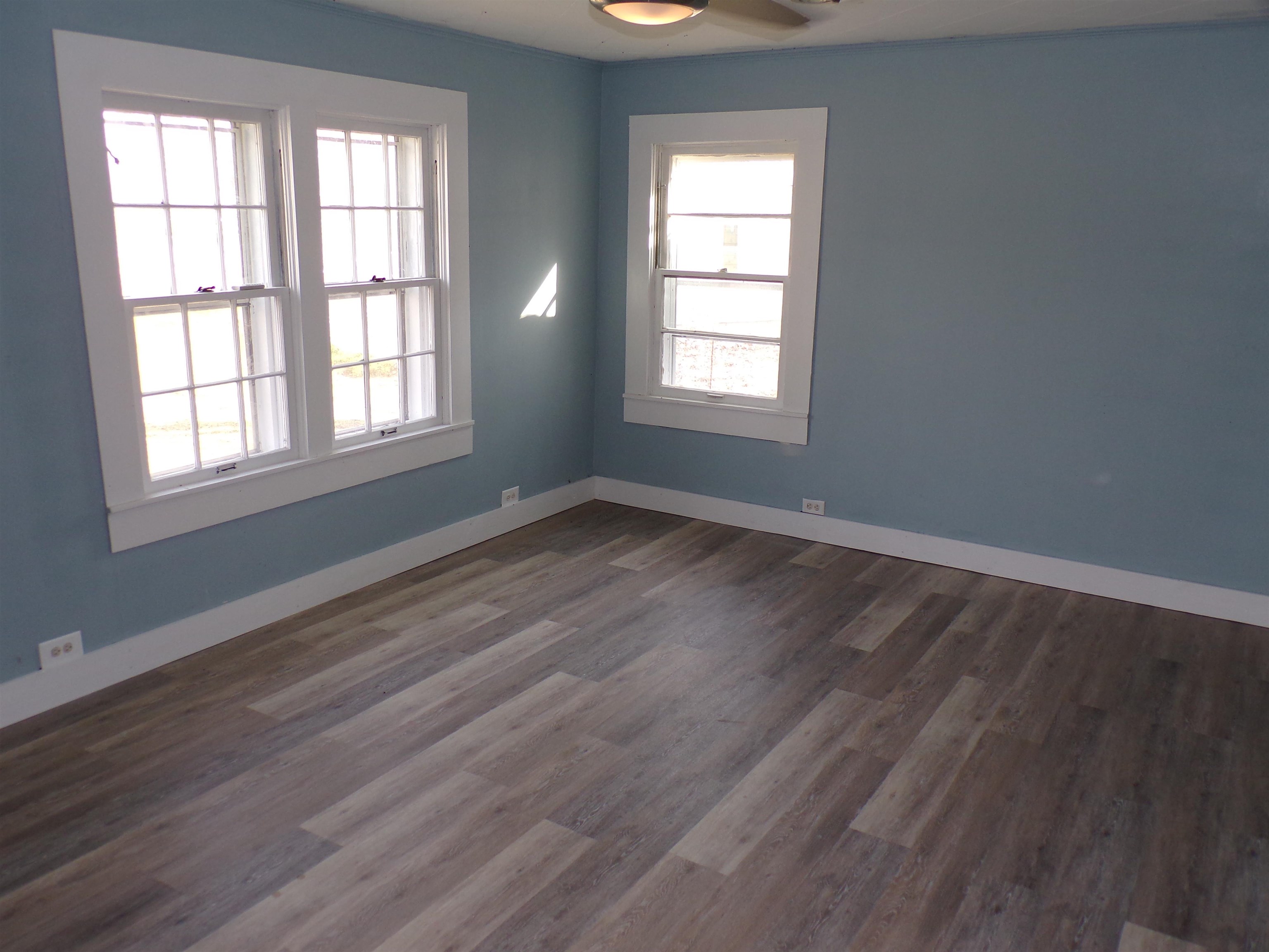 5950 Highway 57 Counce, TN 38326 - Photo 8 of 23 Spare room with dark wood-style flooring and baseboards