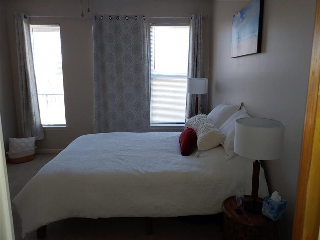 898 Oak Street Southwest, Unit 3405 Atlanta, GA 30310 - Photo 5 of 9 a bedroom with a bed and a window