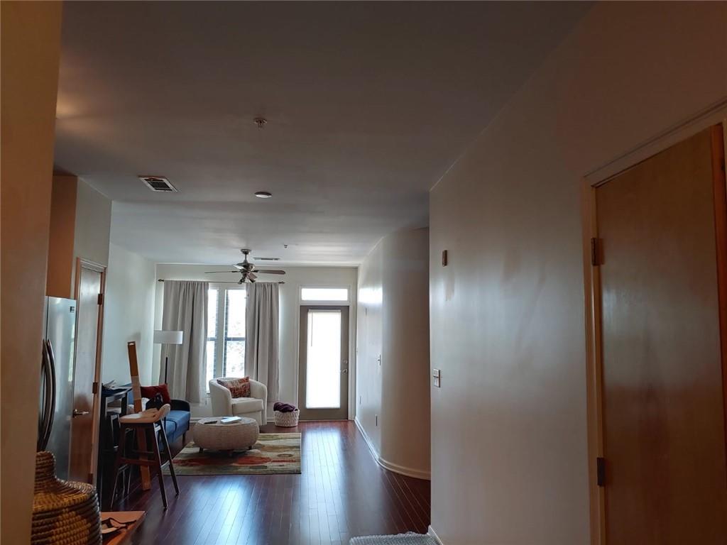 898 Oak Street Southwest, Unit 3405 Atlanta, GA 30310 - Photo 7 of 9 a view of a hallway with livingroom and furniture