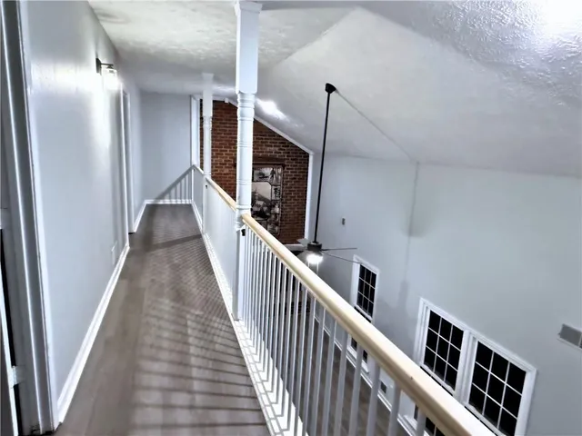 a view of hallway with stairs