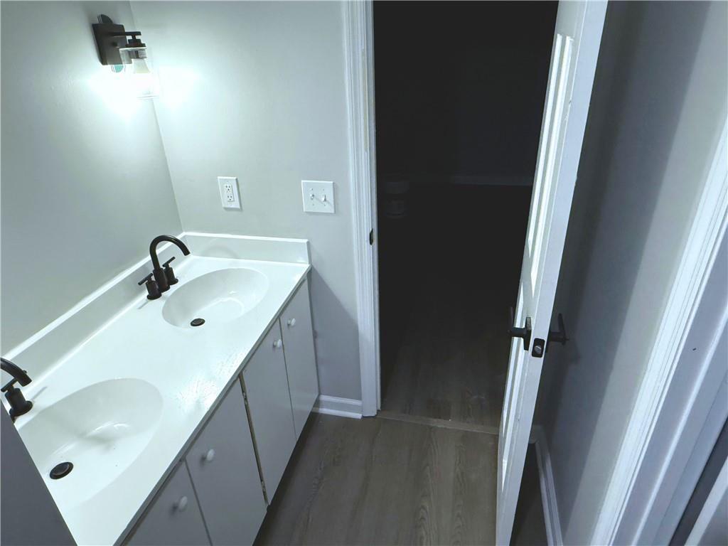 2870 Horseshoe Bend Road Southwest Marietta, GA 30064 - Photo 15 of 21 a bathroom with a sink and mirror with window