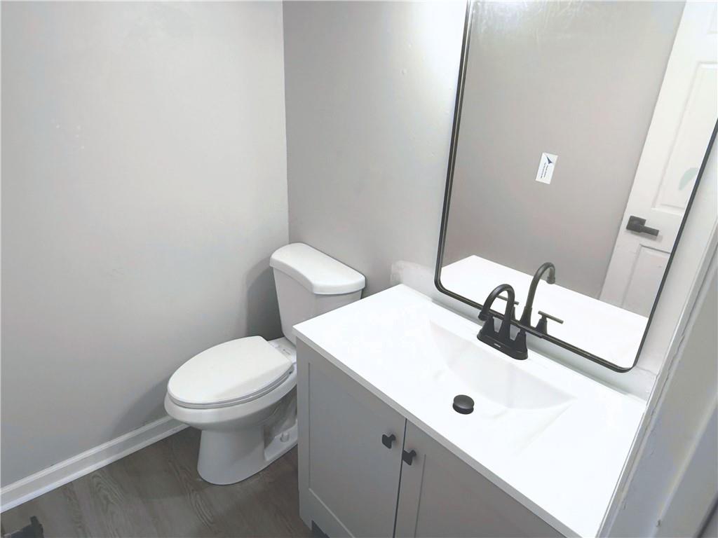 2870 Horseshoe Bend Road Southwest Marietta, GA 30064 - Photo 17 of 21 a bathroom with a sink and a toilet