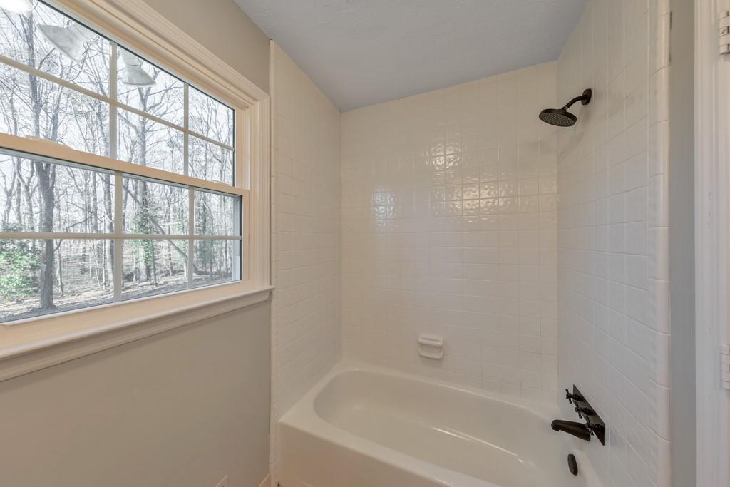 2870 Horseshoe Bend Road Southwest Marietta, GA 30064 - Photo 18 of 37 a bathroom with a bathtub