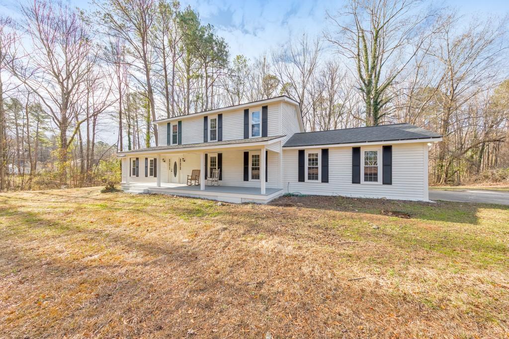 2870 Horseshoe Bend Road Southwest Marietta, GA 30064 - Photo 2 of 37 a house view with swimming pool in front of it