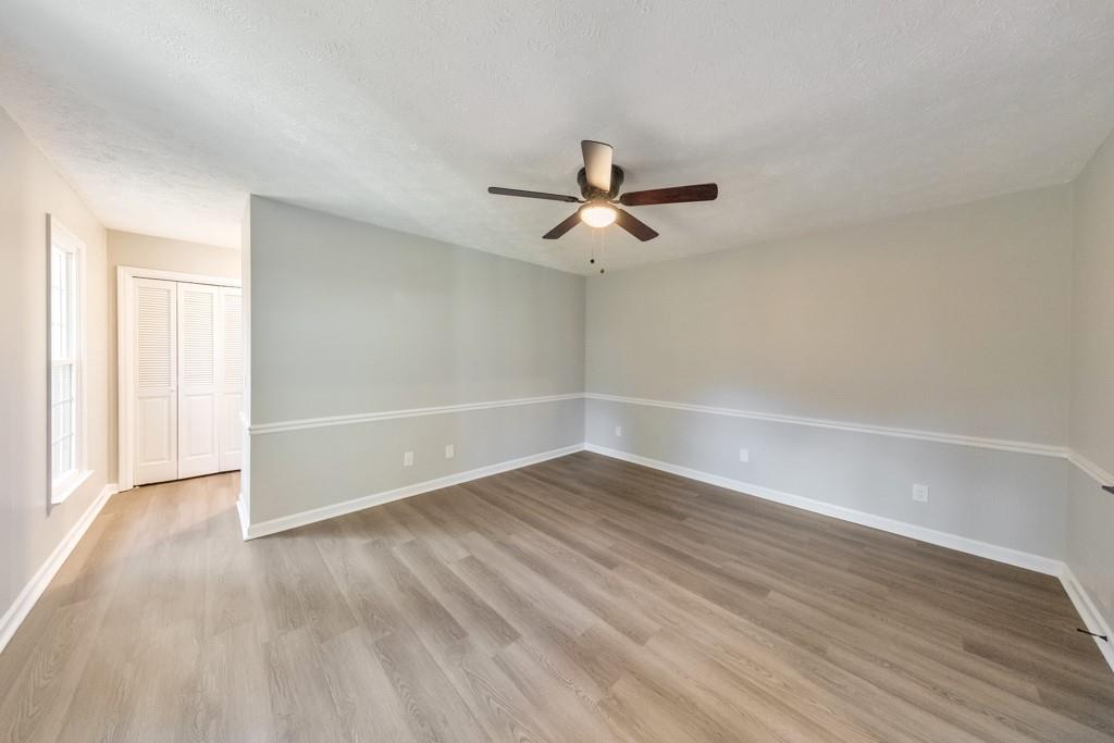 2870 Horseshoe Bend Road Southwest Marietta, GA 30064 - Photo 21 of 37 wooden floor in an empty room with a window