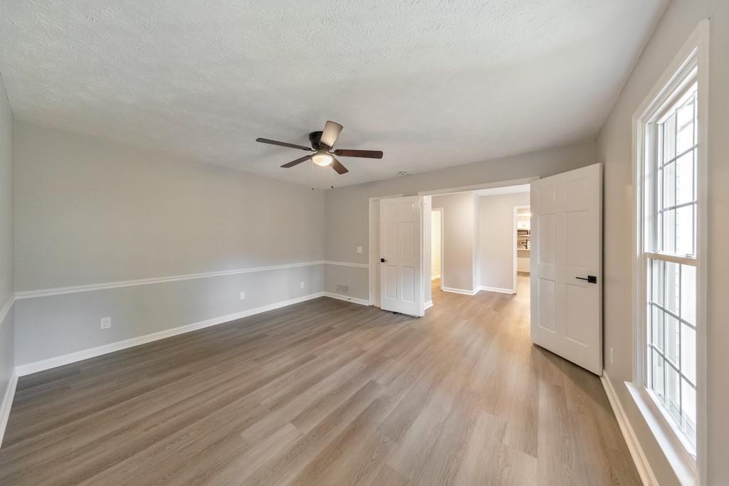 2870 Horseshoe Bend Road Southwest Marietta, GA 30064 - Photo 23 of 37 wooden floor in an empty room with a window