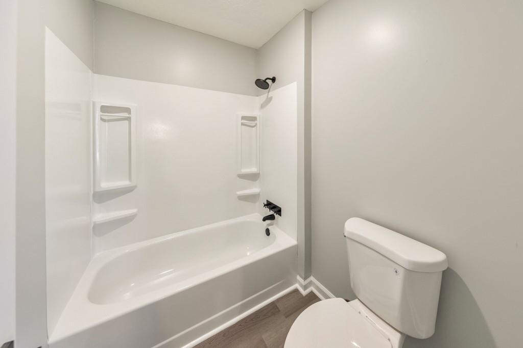 2870 Horseshoe Bend Road Southwest Marietta, GA 30064 - Photo 26 of 37 a bathroom with a toilet and a bathtub