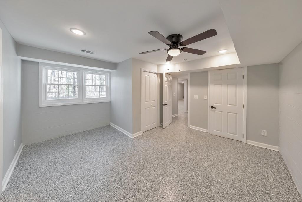 2870 Horseshoe Bend Road Southwest Marietta, GA 30064 - Photo 31 of 37 a view of an empty room and window a ceiling fan