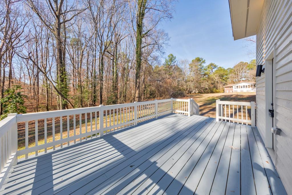 2870 Horseshoe Bend Road Southwest Marietta, GA 30064 - Photo 35 of 37 a view of balcony with wooden floor and fence