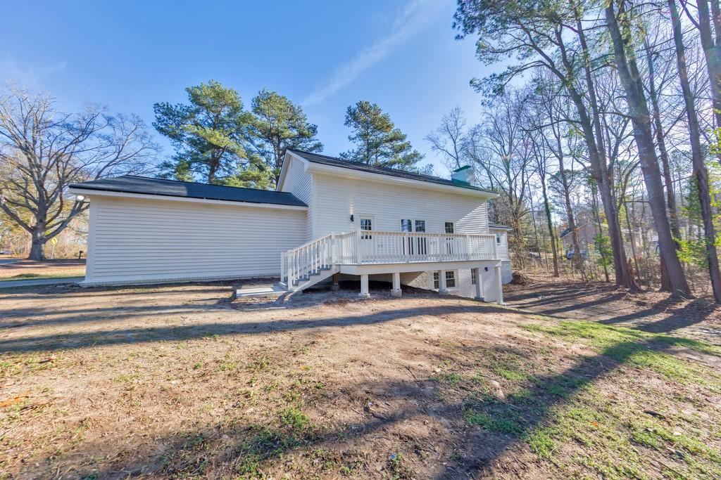 2870 Horseshoe Bend Road Southwest Marietta, GA 30064 - Photo 6 of 37 a view of a house with a yard