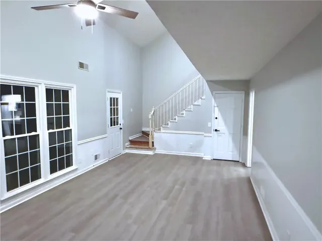 wooden floor in an empty room with a window and wooden floor