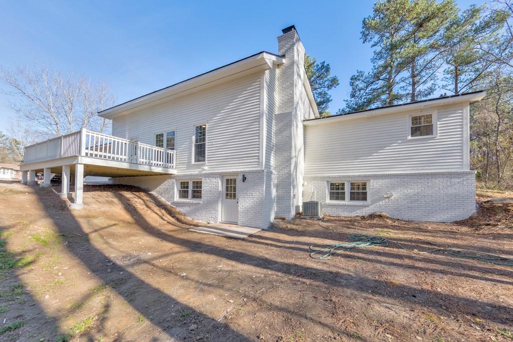 2870 Horseshoe Bend Road Southwest Marietta, GA 30064 - Photo 7 of 37 a view of a house with a patio