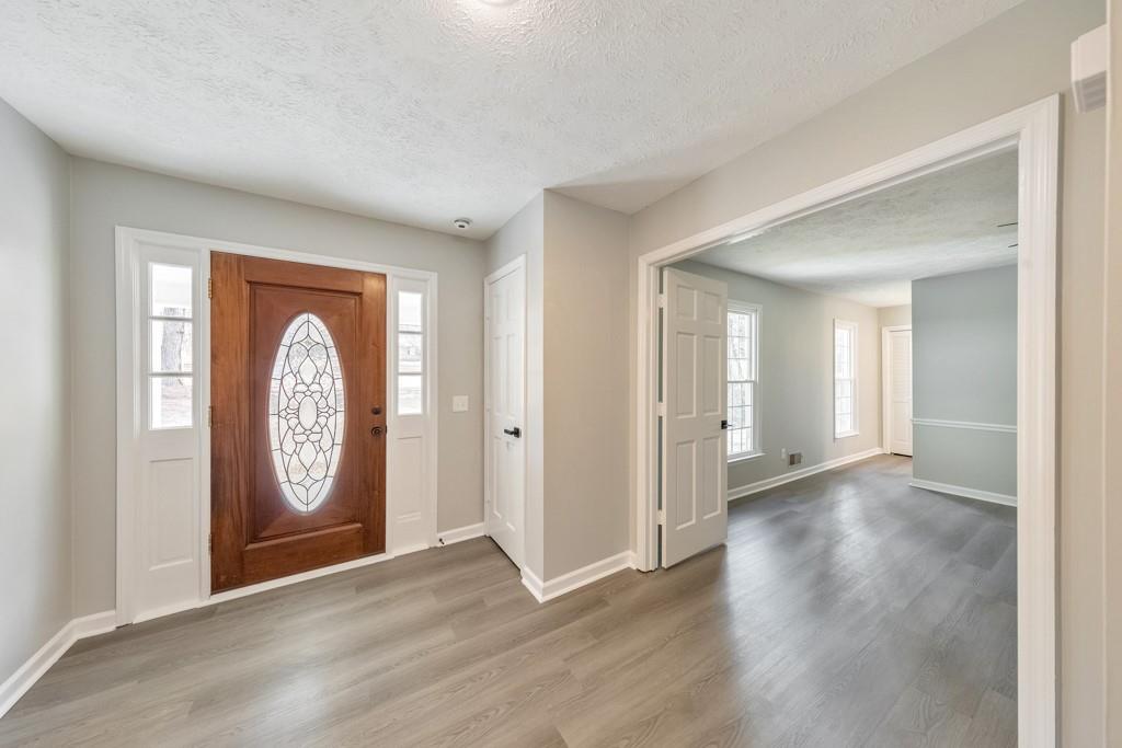 2870 Horseshoe Bend Road Southwest Marietta, GA 30064 - Photo 9 of 37 a view of a hallway with entryway with wooden floor