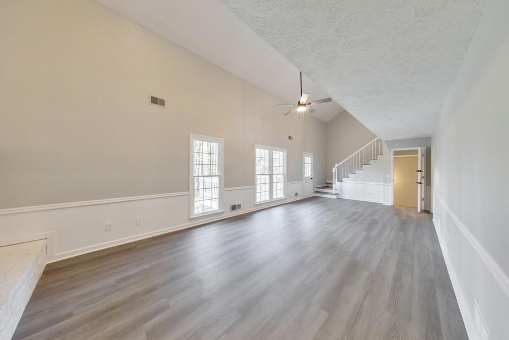 2870 Horseshoe Bend Road Southwest Marietta, GA 30064 - Photo 10 of 37 wooden floor in an empty room with a window