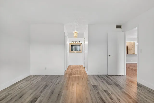 a view of a livingroom with wooden floor