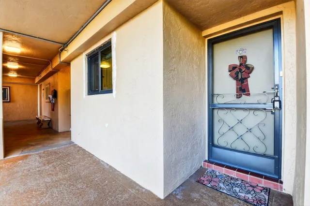 a view of a hallway with paintings on the wall