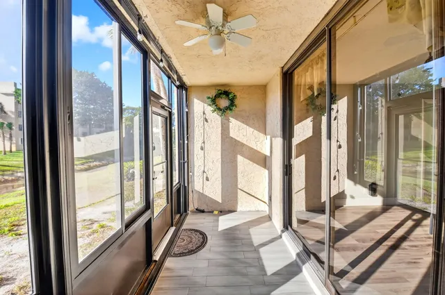a view of a living room with a large window and outer view