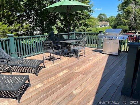 17 Kirby Road Washington, CT 06793 - Photo 11 of 20 a view of a chairs and table on the wooden roof deck